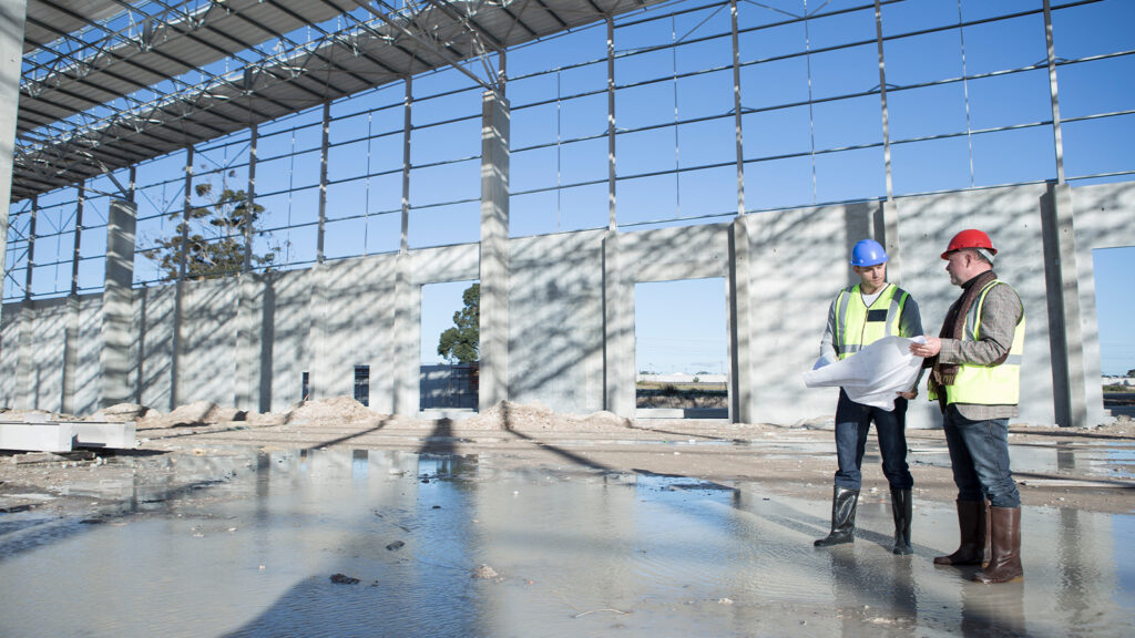 Architect during warehouse construction